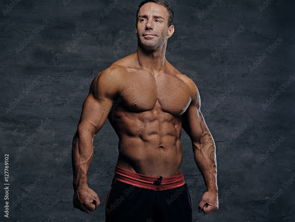 Portrait of shirtless muscular middle age male. Portrait of shirtless muscular middle age male.