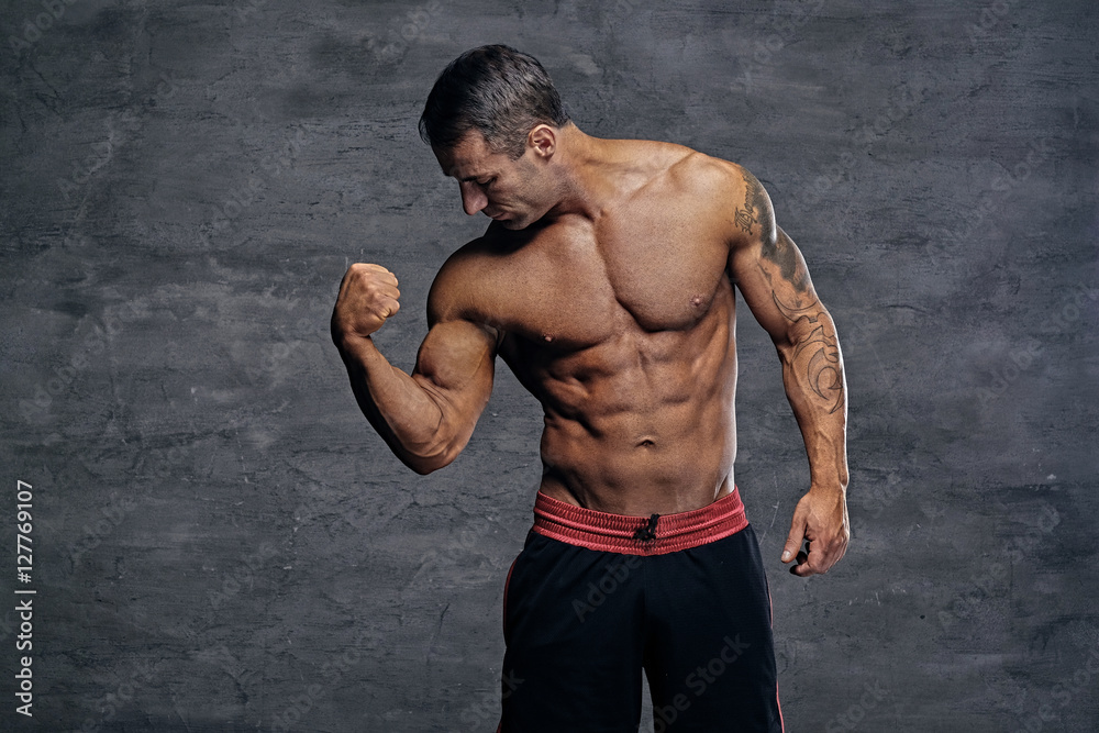 Fototapeta premium Portrait of shirtless muscular middle age male.