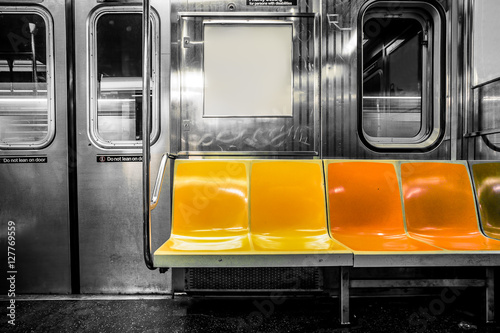 Canvas Print New York City subway car interior with colorful seats