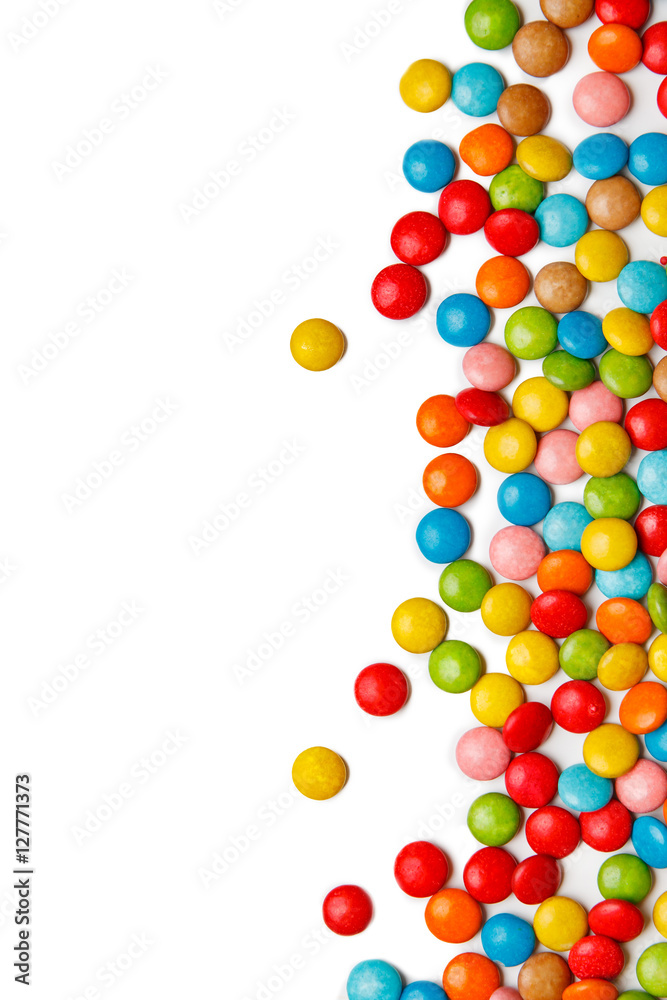 colorful chocolate buttons on white background