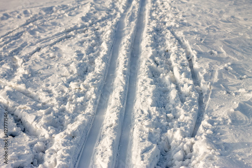 ski trail on the snow background