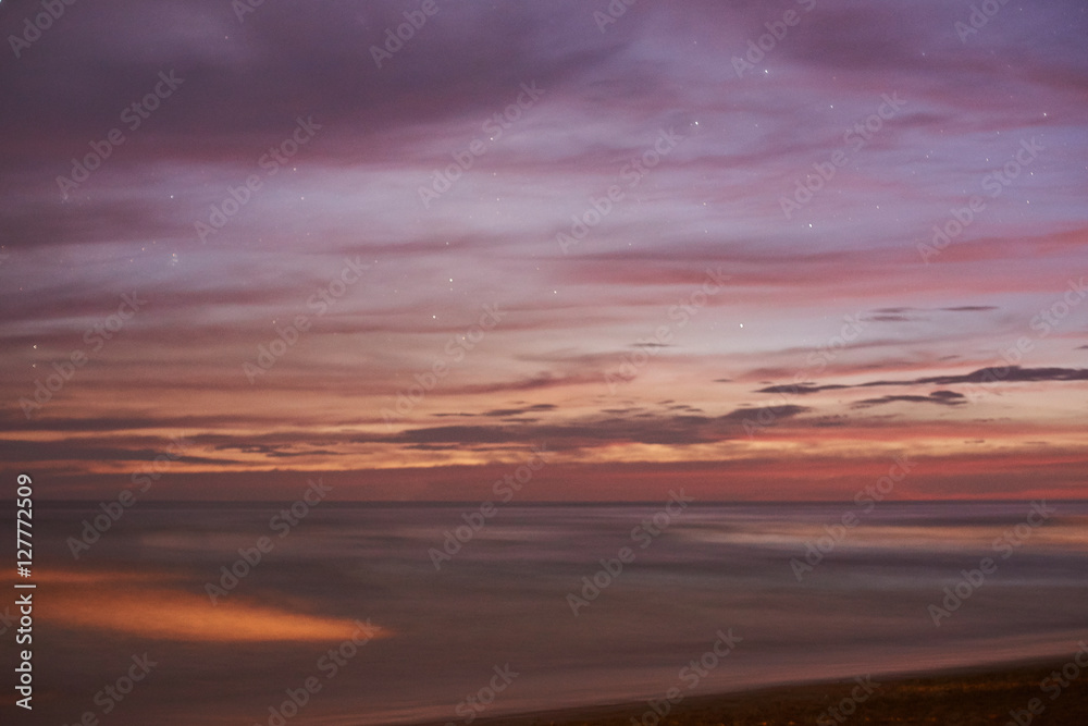 Pink sunset in ocean