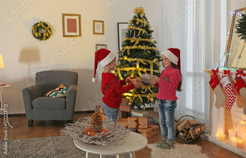Cute little kids in Santa h...