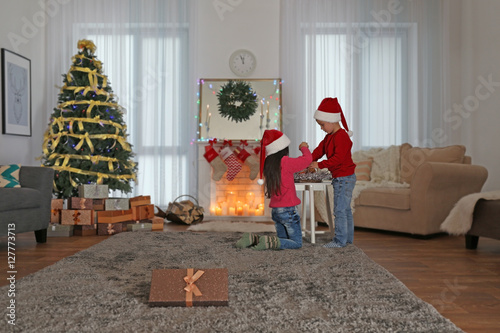 Cute little kids in Santa h...