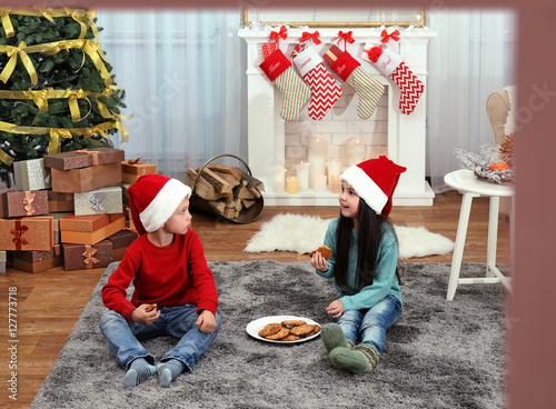 Cute little kids in Santa h...