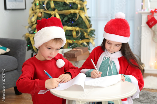 Cute little kids writing le...