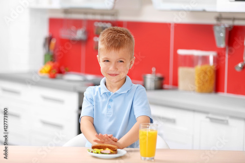 Little boy having breakfast...