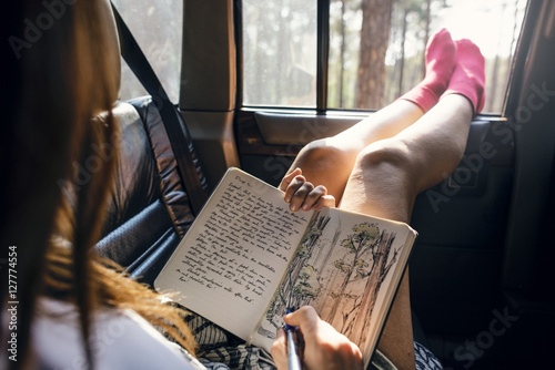 Girl Drawing Pad Road Trip Concept