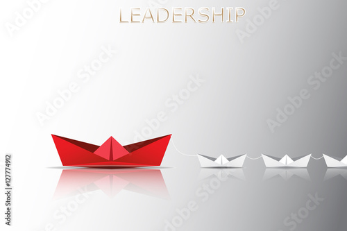 Leadership concept with red paper ship leading among white, Unique and different concept.