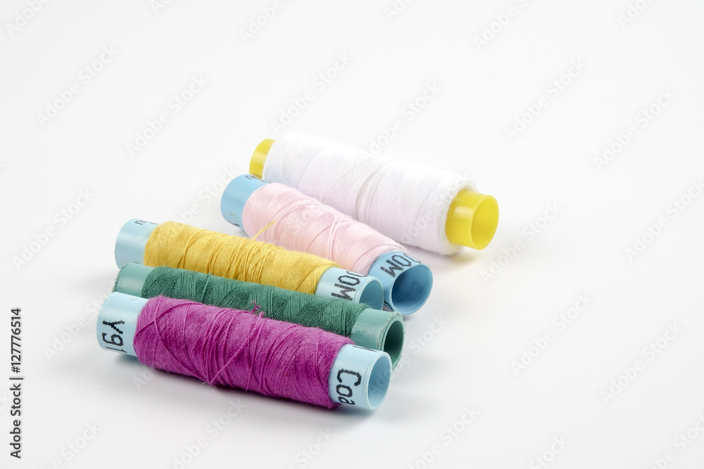 Sewing colored threads isolated on white background Sewing colored threads isolated on white background