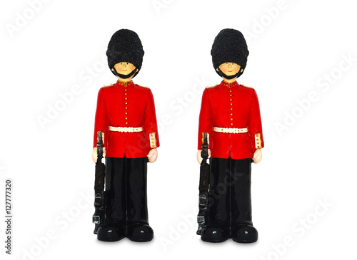 Fotografía two Queen's guard statue in traditional uniform with weapon, British soldier, is