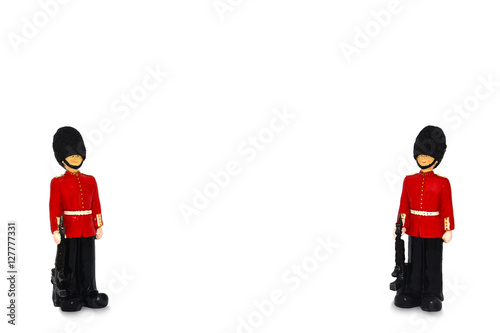 Foto two Queen's guard statue in traditional uniform with weapon, British soldier for