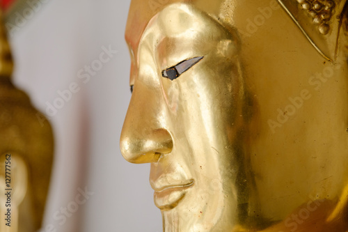 Face of Buddha gold and thai art architecture in Wat Phra Chetupon Vimolmangklararm (Wat Pho) temple in Thailand. Photo taken on: 21 November , 2016 photo