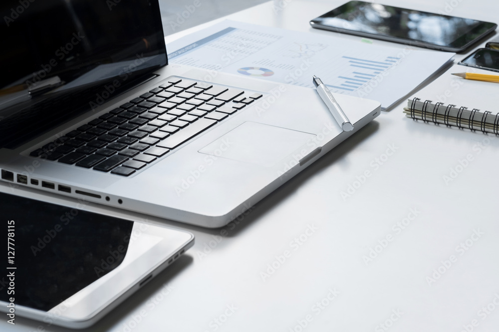 Business desk with a keyboard, report graph chart, pen and table Business desk with a keyboard, report graph chart, pen and table