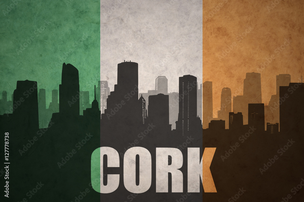abstract silhouette of the city with text Cork at the vintage irish flag