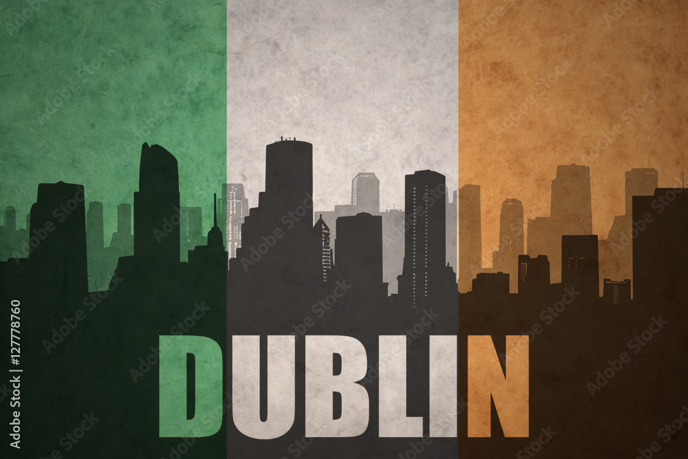 abstract silhouette of the city with text Dublin at the vintage irish flag