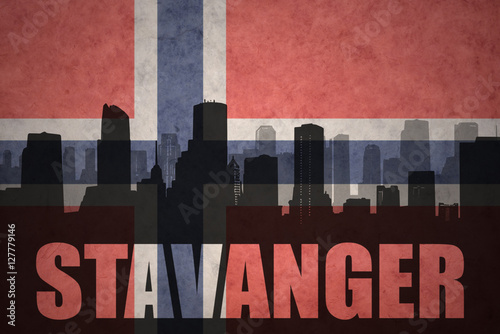 abstract silhouette of the city with text Stavanger at the vintage norwegian flag