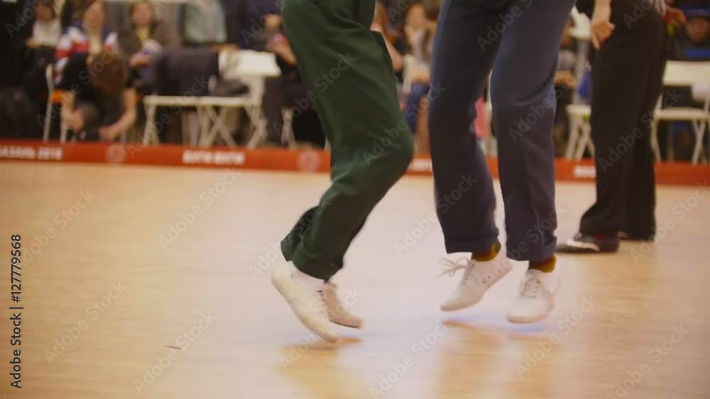 Couples dancing Boogie woogie rock-n-roll. Dance competitions, slow-motion