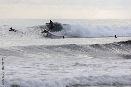 A boy surfing at beach. 