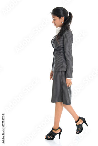 Side view Indian business woman walking