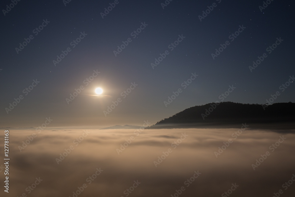 moon and fog in the morning with mountain at Khao Kho, Thailand moon and fog in the morning with mountain at Khao Kho, Thailand