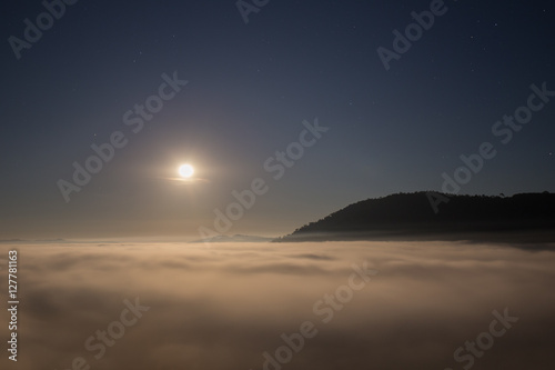 moon and fog in the morning with mountain at Khao Kho, Thailand