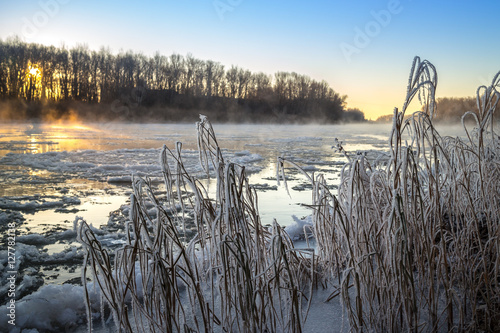 Sunrise during freeze-up in the river