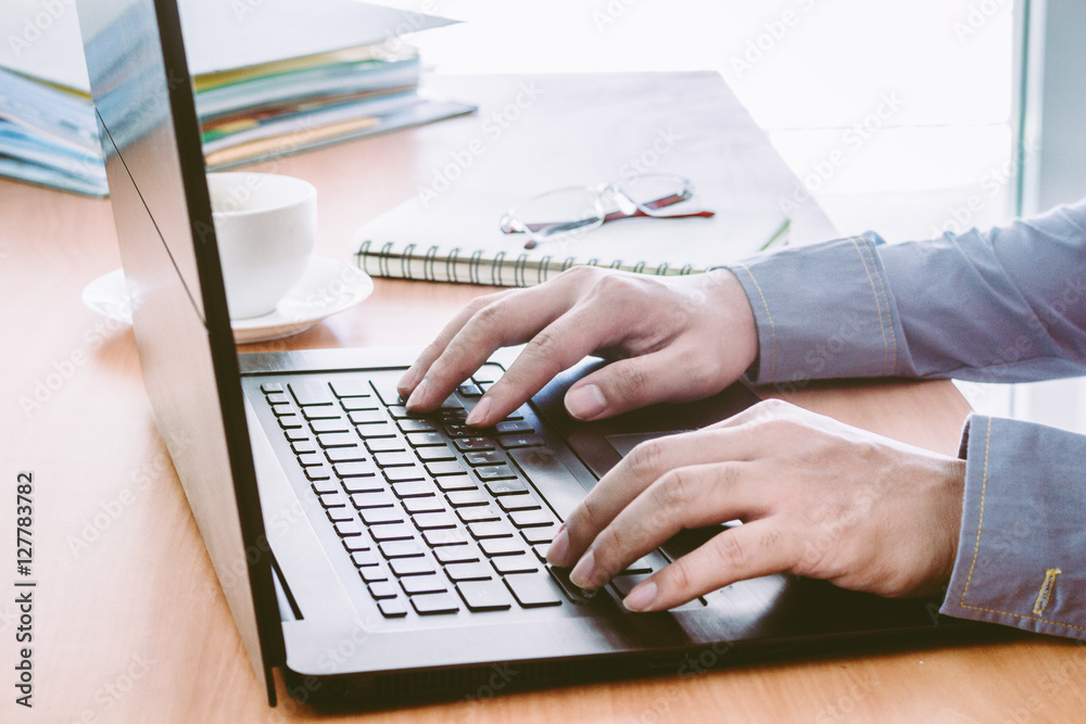 Businessman Using Laptop with coffee Businessman Using Laptop with coffee