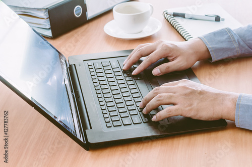 Businessman Using Laptop with coffee