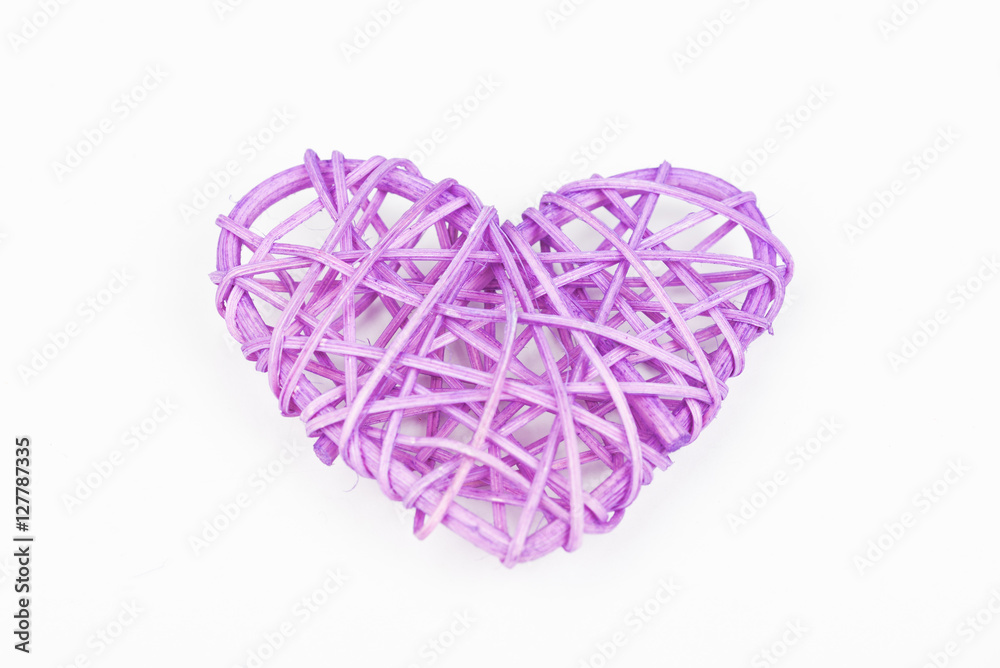 Purple woven Valentines day/Christmas/ Mothers day/ anniversary decorations - heart isolated, on white background. Wicker heart. Closeup.
