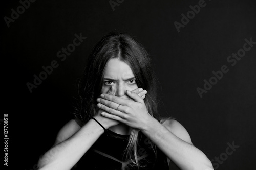 Wallpaper Mural Speak no evil. The girl closes your mouth. Long hair Torontodigital.ca