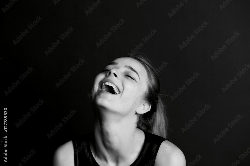 Emotional portrait of a beautiful girl with long hair. Broad good-natured happy smile Emotional portrait of a beautiful girl with long hair. Broad good-natured happy smile