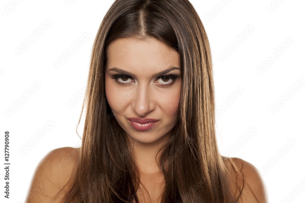 portrait of a beautiful frown woman with a skeptical look portrait of a beautiful frown woman with a skeptical look