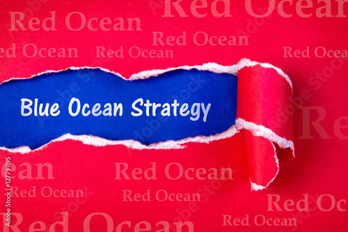 Blue ocean strategy word on Torn red Paper 