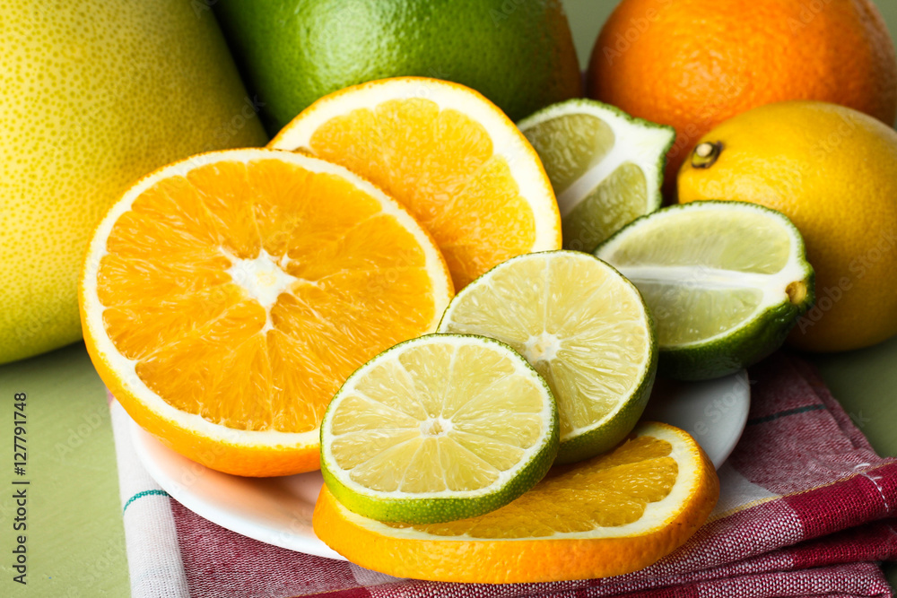 Sliced fresh citrus fruit on a plate.
