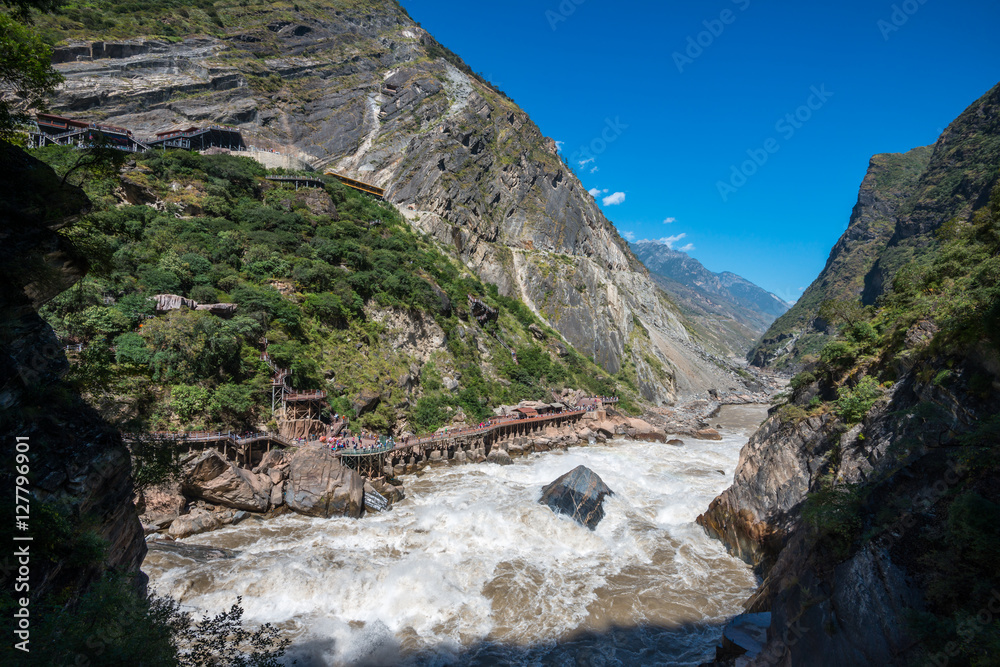 Lijiang Ancient Town, Lijiang Attractions. One of the deepest canyons in the world r there is a rock in the middle of Golden Sand River called Tiger Leaping Rock in Hu Tiao Xia, Lijiang, Yunnan, China