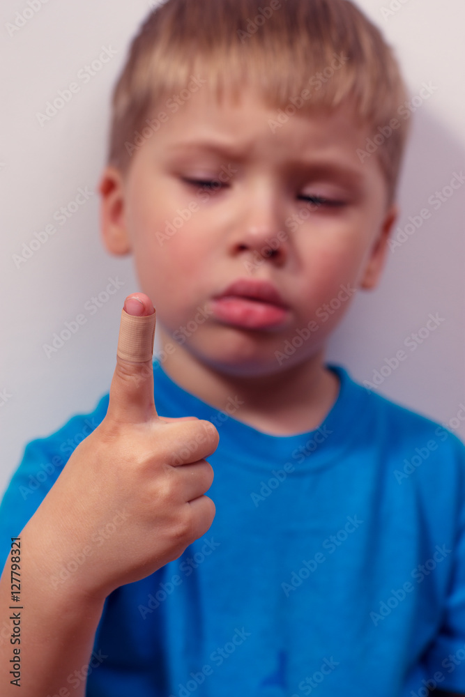Portrait of little boy with hurt finger Portrait of little boy with hurt finger