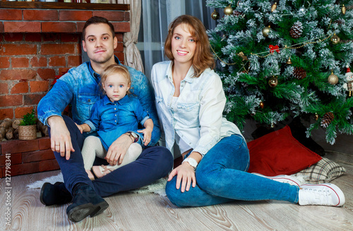 happy family with a child at home at Christmas time photo
