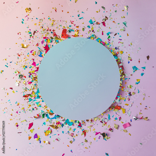 Colorful celebration background with party confetti on pink back
