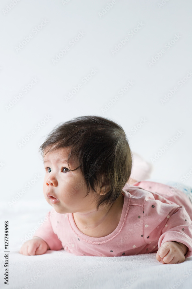 newborn baby girl in pink dress on white background newborn baby girl in pink dress on white background