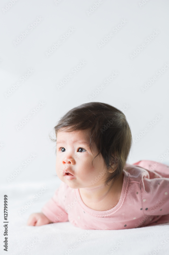 newborn baby girl in pink dress on white background newborn baby girl in pink dress on white background