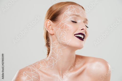 Beauty image of smiling girl with body art