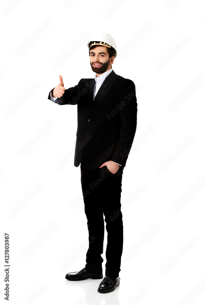 Engineer in protective helmet with thumbs up. Engineer in protective helmet with thumbs up.