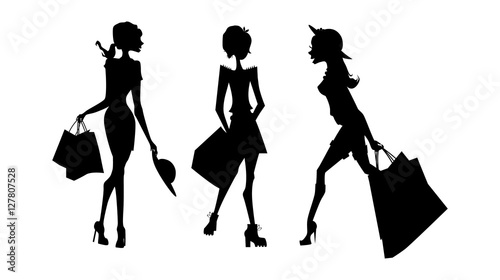 Shopping sillhouettes set. Black sillhouettes of women with shopping bags on white background. Elegant, young and slim women.