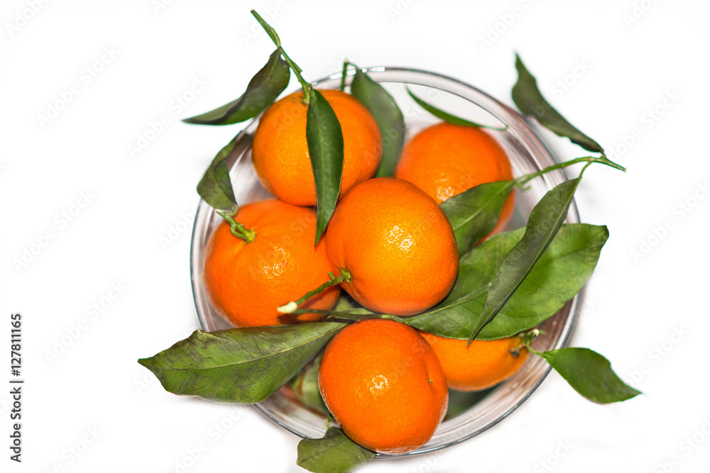 mandarines are in a vaseon . white background mandarines are in a vaseon . white background