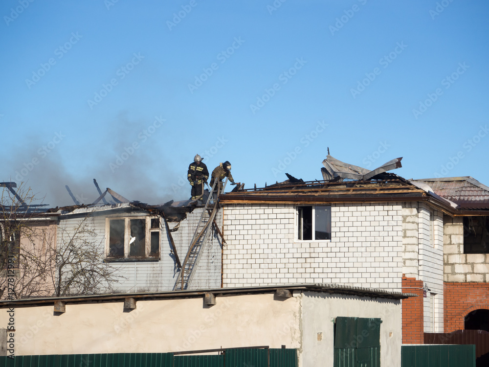 Fototapeta premium firefighters extinguish a fire