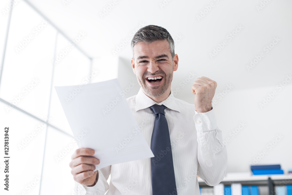 Cheerful businessman receiving good news Cheerful businessman receiving good news
