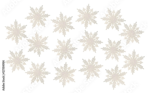 Group of plastic glitter snowflakes on a white background