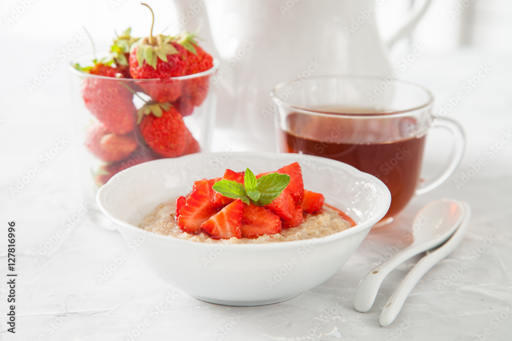 porridge with strawberry on a table, selective focus porridge with strawberry on a table, selective focus