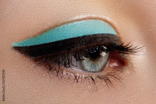 Wall Mural Beautiful macro shot of female eye with classic smoky makeup